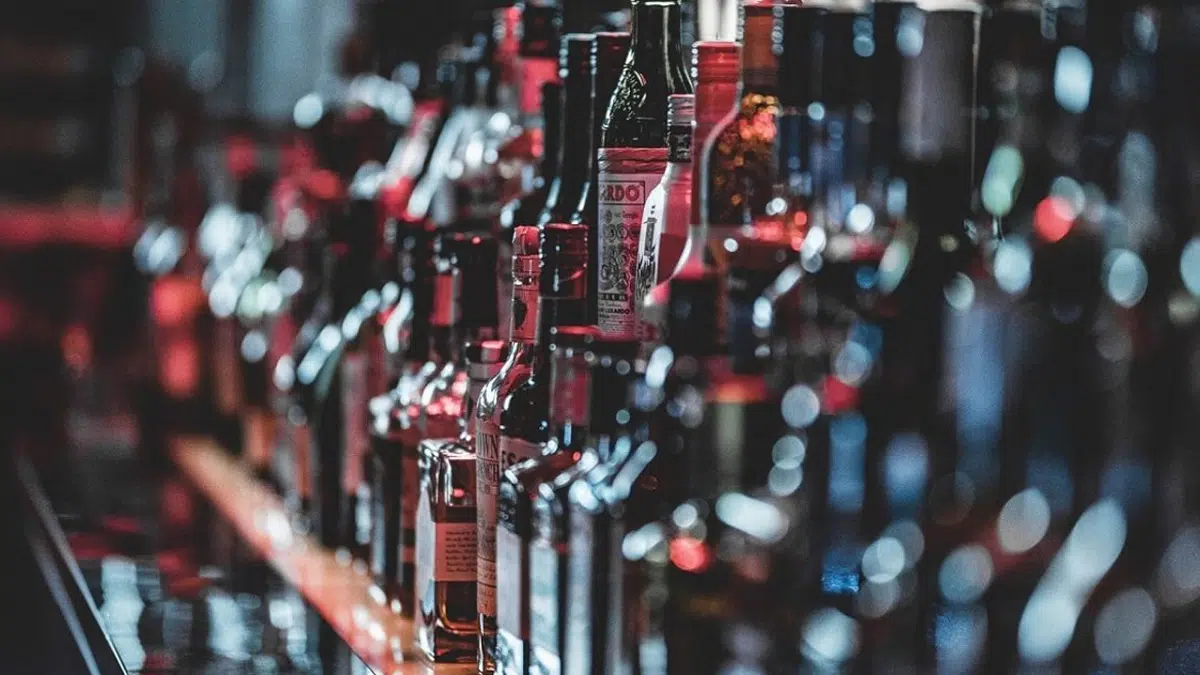 Closeup of liquor bottles. An estimated 14.5 million adults in the United States suffer from alcohol use disorder (AUD).