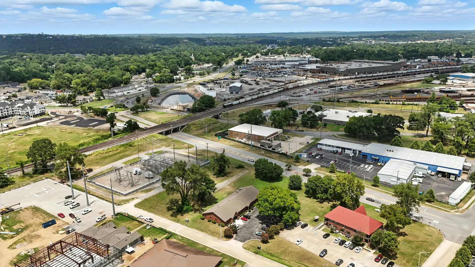 An aerial view of an industrial area with buildings and a railway yard.
