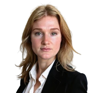 A headshot of a woman with blonde hair wearing a dark jacket over a white shirt. A headshot of a woman with blonde hair wearing a dark jacket over a white shirt.