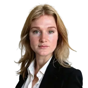 A headshot of a woman with blonde hair wearing a dark jacket over a white shirt. A headshot of a woman with blonde hair wearing a dark jacket over a white shirt.