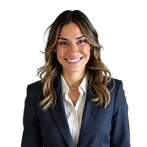 A headshot of a smiling woman with long dark hair wearing a black blazer over a white shirt.